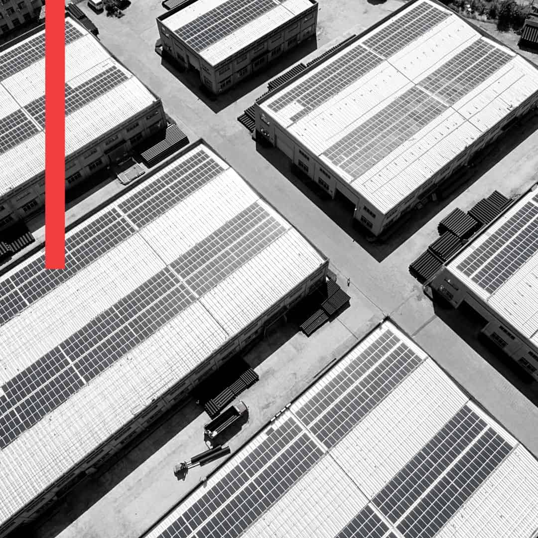Black and white photo of large commercial rooftop solar program
