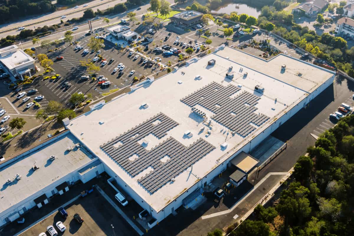 aerial shot of solar project on roof of commercial building 